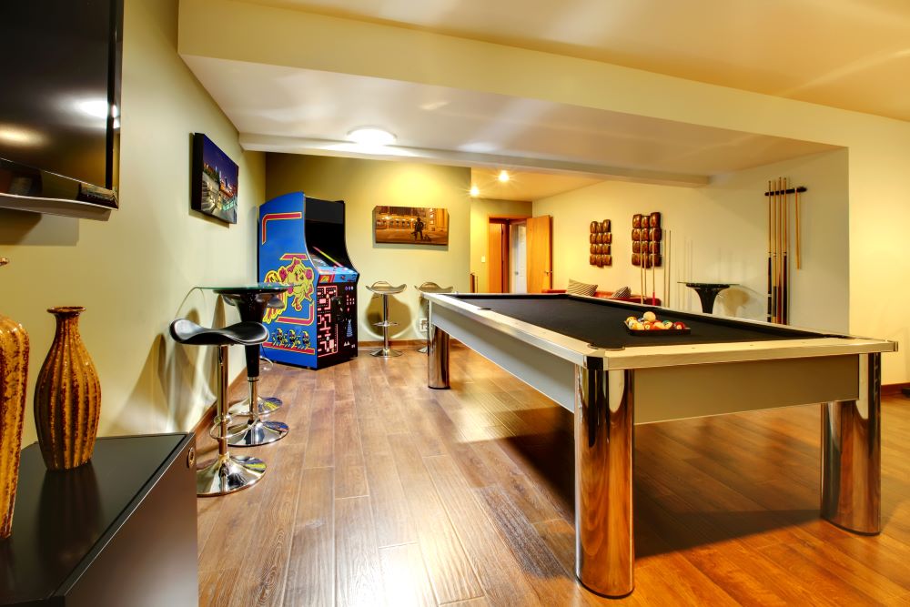 Play party room home interior with pool table in the basement