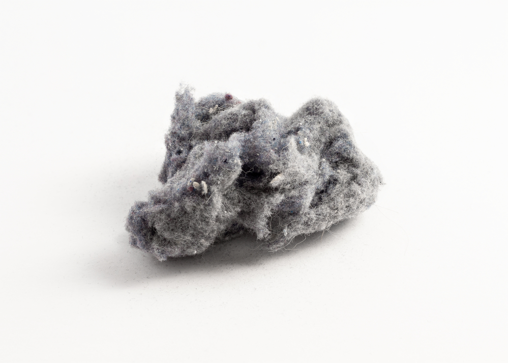  lint on white background dryer exhaust in the furnace is dngerous