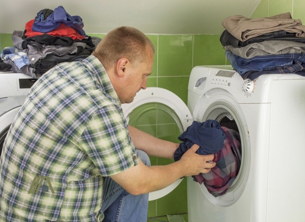 loading too much clothes in dryer