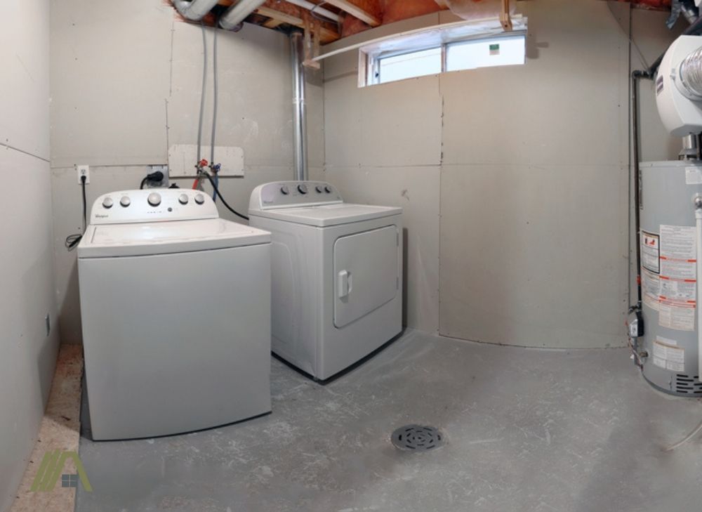 White laundry gas dryer and white laundry washer with heater