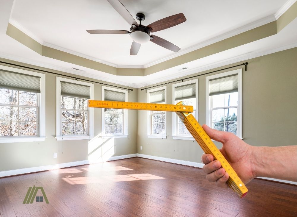 Room with ceiling fan and yardstick