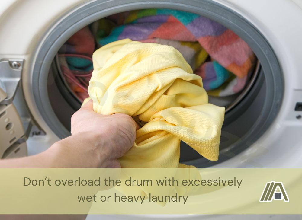 Putting a yellow shirt inside the washer or dryer with a text saying "Don’t overload the drum with excessively wet or heavy laundry"