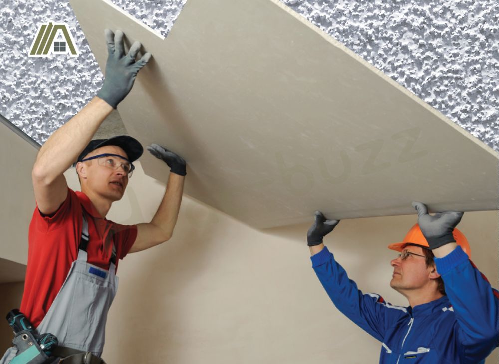 Men installing a drywall on a popcorn ceiling