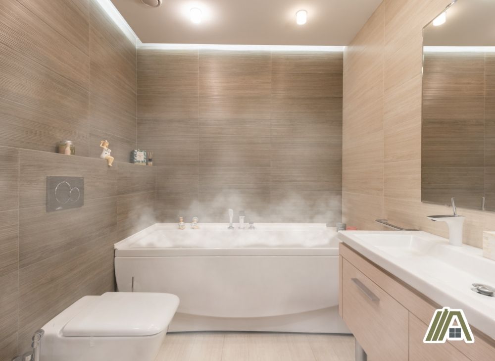 Modern bathroom with bathtub filled with steamy air