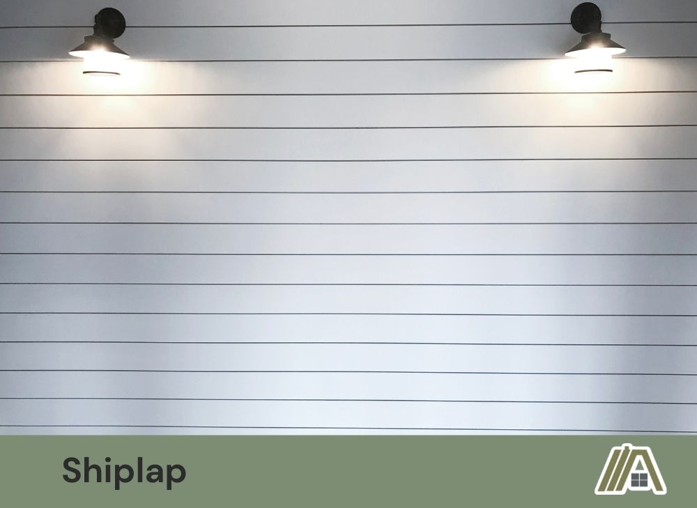 White shiplap with two wall lamp with black metal accent