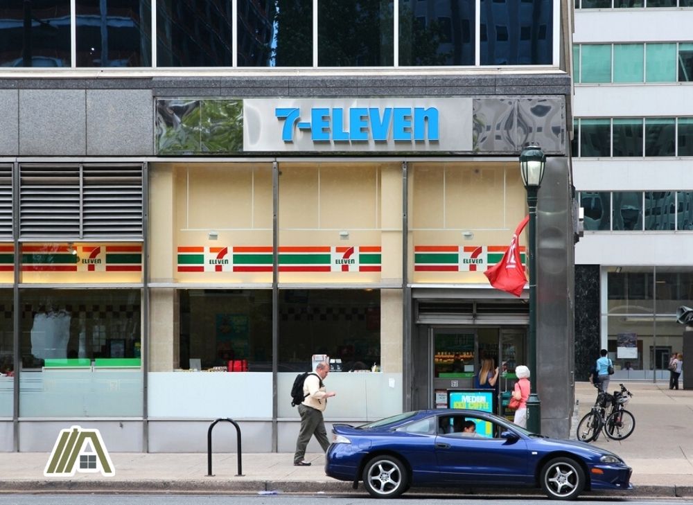 7-11 store in Unites States, car parked in front of a 7-11 store