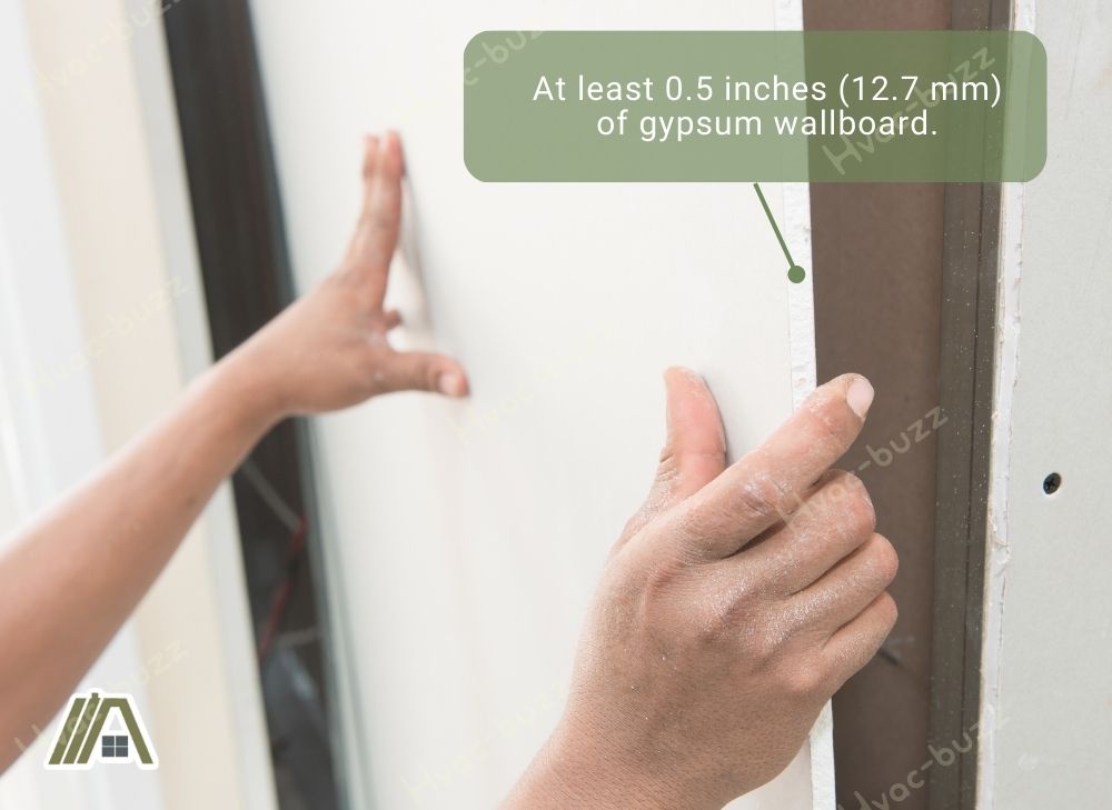At least 0.5 inches (12.7 mm) of gypsum wallboard