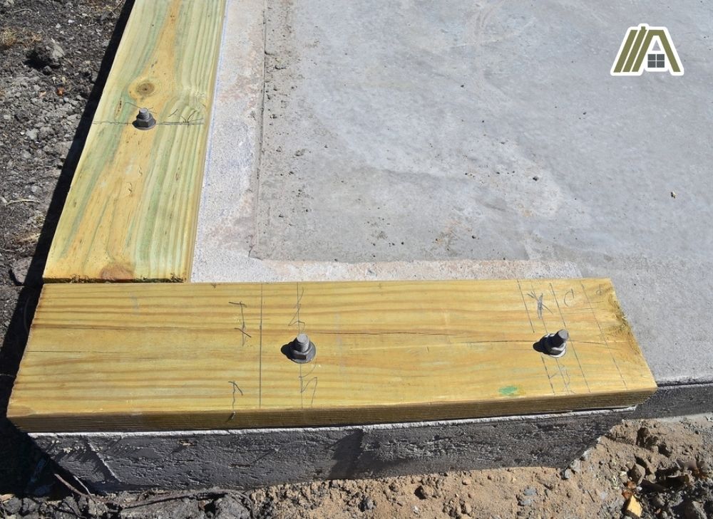 foundation for a newly poured slab for a garage with sill plate.jpg